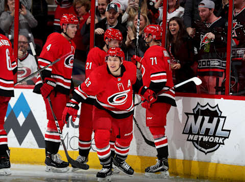 RALEIGH, NC – JANUARY 12: Jeff Skinner #53 of the Carolina Hurricanes scores a goal and celebrates with team mates during an NHL game against the Washington Capitals on January 12, 2018 at PNC Arena in Raleigh, North Carolina. (Photo by Gregg Forwerck/NHLI via Getty Images)