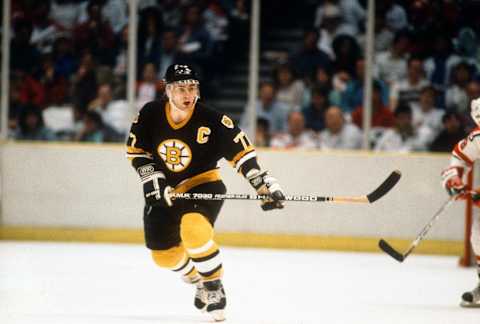 EAST RUTHERFORD, NJ – CIRCA 1987: Ray Bourque #77 of the Boston Bruins skates against the New Jersey Devils during an NHL Hockey game circa 1987 at the Brendan Byrne Arena in East Rutherford, New Jersey. Bourque’s playing career went from 1979-2001. (Photo by Focus on Sport/Getty Images)