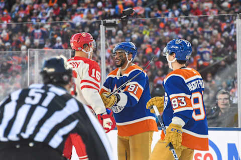 EDMONTON, CANADA – OCTOBER 29: Nikita Zadorov #16 of the Calgary Flames exchanges words with Evander Kane #91 of the Edmonton Oilers during a break in play in the first period of the 2023 Tim Hortons NHL Heritage Classic at Commonwealth Stadium on October 29, 2023 in Edmonton, Alberta, Canada. (Photo by Derek Leung/Getty Images)