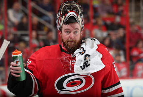 RALEIGH, NC – NOVEMBER 11: Scott Darling #33 of the Carolina Hurricanes gets a drink of water duing a time out of an NHL game against the Chicago Blackhawks on November 11, 2017 at PNC Arena in Raleigh, North Carolina. (Photo by Gregg Forwerck/NHLI via Getty Images)