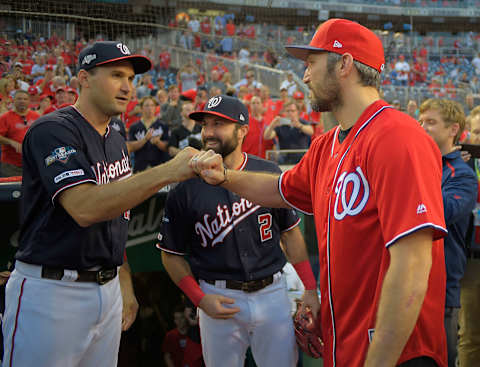 WASHINGTON, DC – OCTOBER 7: Washington Nationals first baseman Ryan Zimmerman (11), left, and Washington Nationals right fielder Adam Eaton (2) greet Capitals Alex Ovechkin as he waits to throw out the first pitch before a game between the Washington Nationals and the Los Angeles Dodgers in game 4 of the National League Division Series at Nationals Stadium in Washington, DC on October 7, 2019 . (Photo by John McDonnell/The Washington Post via Getty Images)