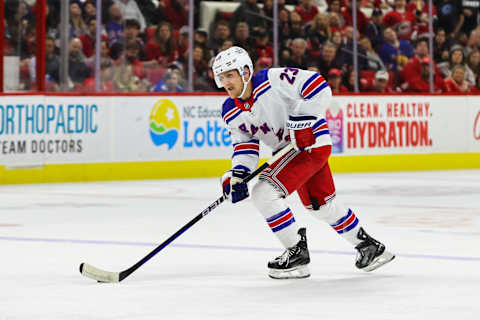 RALEIGH, NC – MARCH 23: Adam Fox #23 of the New York Rangers skates with the puck during the first period of the game against the Carolina Hurricanes at PNC Arena on March 23, 2023 in Raleigh, North Carolina. Rangers win over Hurricanes 2-1.(Photo by Jaylynn Nash/Getty Images)