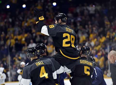 Jan 31, 2016; Nashville, TN, USA; Pacific Division forward John Scott (28) of the Montreal Canadiens is picked up by his teammates after beating the Atlantic Division during the championship game of the 2016 NHL All Star Game at Bridgestone Arena. Mandatory Credit: Christopher Hanewinckel-USA TODAY Sports