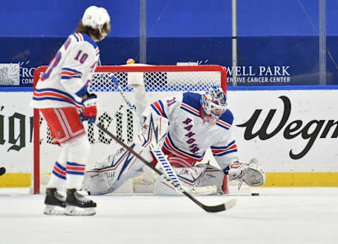 Jan 28, 2021; Buffalo, New York, USA; New York Rangers goaltender Igor Shesterkin (31) covers the puck in the third period against the Buffalo Sabres at KeyBank Center. Mandatory Credit: Mark Konezny-USA TODAY Sports