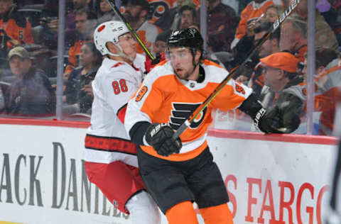 PHILADELPHIA, PA – MARCH 05: Ivan Provorov #9 of the Philadelphia Flyers and Martin Necas #88 of the Carolina Hurricanes collide in the second period at Wells Fargo Center on March 5, 2020, in Philadelphia, Pennsylvania. (Photo by Drew Hallowell/Getty Images)