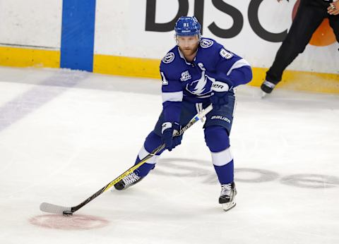 TAMPA, FL – MAY 23: Steven Stamkos #91 of the Tampa Bay Lightning looks to move the puck against the Washington Capitals in Game Seven of the Eastern Conference Finals during the 2018 NHL Stanley Cup Playoffs at Amalie Arena on May 23, 2018 in Tampa, Florida.. (Photo by Mike Carlson/Getty Images)