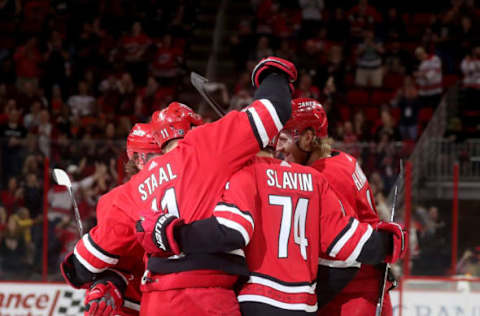 RALEIGH, NC – MARCH 30: Dougie Hamilton #19 of the Carolina Hurricanes scores a goal and celebrates with teammates Andrei Svechnikov #37, Brock McGinn #23, Jordan Staal #11 and Jaccob Slavin #74 during an NHL game against the Philadelphia Flyers on March 30, 2019 at PNC Arena in Raleigh, North Carolina. (Photo by Gregg Forwerck/NHLI via Getty Images)