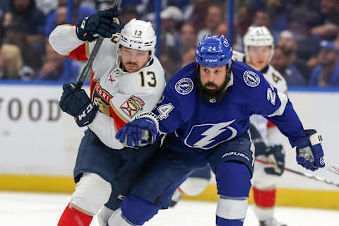 TAMPA, FL – MAY 23: Zach Bogosian #24 of the Tampa Bay Lightning and Sam Reinhart #13 of the Florida Panthers tangle for the puck during the first period in Game Four of the Second Round of the 2022 Stanley Cup Playoffs at Amalie Arena on May 23, 2022 in Tampa, Florida. (Photo by Mike Carlson/Getty Images)