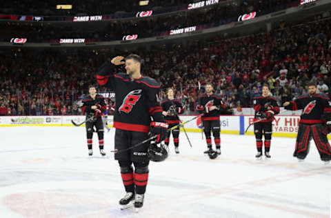 RALEIGH, NC – JANUARY 19: Justin Williams #14 of the Carolina Hurricanes salutes the fans during a Storm Surge on Military Appreciation Night following an NHL game against the New York Islanders on January 19, 2020 at PNC Arena in Raleigh, North Carolina. (Photo by Gregg Forwerck/NHLI via Getty Images)