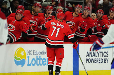 RALEIGH, NC – OCTOBER 3: Lucas Wallmark #71 of the Carolina Hurricanes is congratulated by teammates after scoring a first period goal during an NHL game against the Montreal Canadiens on October 3, 2019 at PNC Arena in Raleigh North Carolina. (Photo by Gregg Forwerck/NHLI via Getty Images)