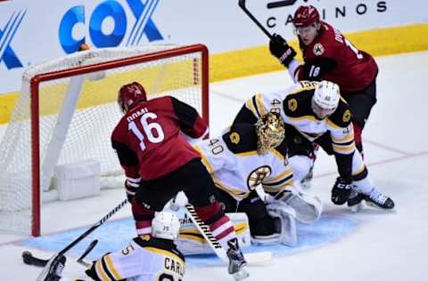 Nov 12, 2016; Glendale, AZ, USA; Arizona Coyotes center Max Domi (16) misses an empty net as Boston Bruins goalie Tuukka Rask (40) is out of position during the second period at Gila River Arena. Mandatory Credit: Matt Kartozian-USA TODAY Sports