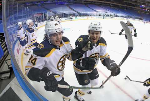 NEW YORK, NEW YORK – FEBRUARY 10: Jeremy Lauzon #55 jumps into Jake DeBrusk #74 of the Boston Bruins during warm-up prior to the game against the New York Rangers at Madison Square Garden on February 10, 2021 in New York City. (Photo by Bruce Bennett/Getty Images)