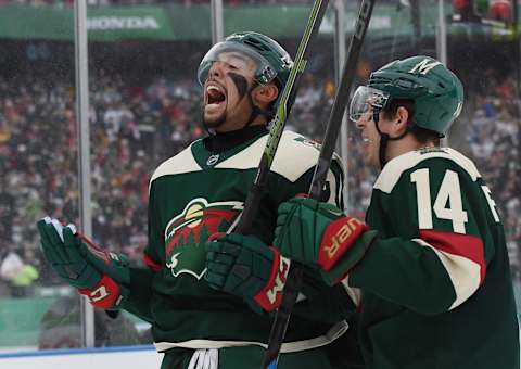 MINNEAPOLIS, MN – FEBRUARY 21: Matt Dumba #24 of the Minnesota Wild celebrates his goal along with Justin Fontaine #14 at 3:25 of the first period against the Chicago at the TCF Bank Stadium during the 2016 Coors Light Stadium Series game on February 21, 2016 in Minneapolis, Minnesota. (Photo by Hannah Foslien/Getty Images)