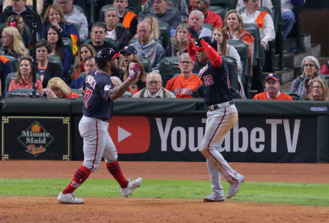 Oct 30, 2019; Houston, TX, USA; Washington Nationals designated hitter Howie Kendrick (47) celebrates with left fielder Juan Soto (22) after hitting a two-run home run against the Houston Astros during the seventh inning in game seven of the 2019 World Series at Minute Maid Park. Mandatory Credit: Erik Williams-USA TODAY Sports