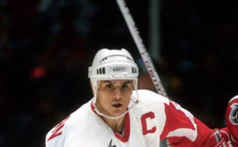 DETROIT, MI – CIRCA 1991: Steve Yzerman #19 of the Detroit Redwings skates against the New Jersey Devils during an NHL Hockey game circa 1991 at the Joe Louis Arena in Detroit, Michigan. Yzerman’s playing career went from 1983-2006. (Photo by Focus on Sport/Getty Images)