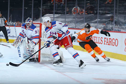 Jacob Trouba #8 of the New York Rangers controls the puck against James van Riemsdyk #25 of the Philadelphia Flyers (Photo by Mitchell Leff/Getty Images)