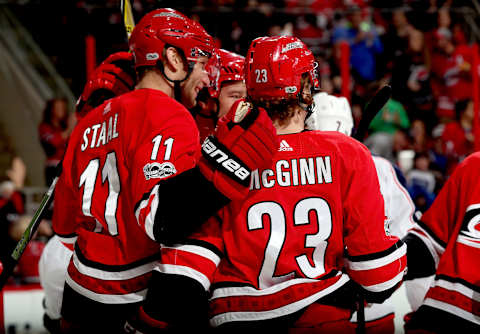 RALEIGH, NC – DECEMBER 16: Jordan Staal #11 of the Carolina Hurricanes scores a goal and celebrates with teammate Brock McGinn #23 during an NHL game against the Columbus Blue Jackets on December 16, 2017 at PNC Arena in Raleigh, North Carolina. (Photo by Gregg Forwerck/NHLI via Getty Images)