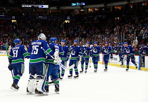 Jacob Markstrom #25 of the Vancouver Canucks and his teammates (Photo by Jeff Vinnick/NHLI via Getty Images)