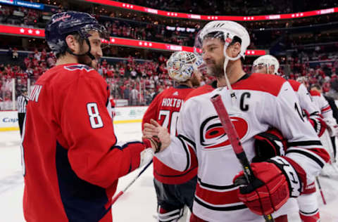 WASHINGTON, DC – APRIL 24: Alex Ovechkin #8 of the Washington Capitals and Justin Williams #14 of the Carolina Hurricanes shake hands after the Hurricanes defeated the Capitals 4-3 in the second overtime period in Game Seven of the Eastern Conference First Round during the 2019 NHL Stanley Cup Playoffs at Capital One Arena on April 24, 2019 in Washington, DC. (Photo by Patrick McDermott/NHLI via Getty Images)