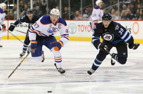 NHL Power Rankings: Edmonton Oilers forward Connor McDavid (97) and Winnipeg Jets defenceman Toby Enstrom (39) race for the puck in the third period during the NHL hockey game against the Edmonton Oilers at MTS Centre. Edmonton Oilers win 6-3 Mandatory Credit: Ray Peters-USA TODAY Sports