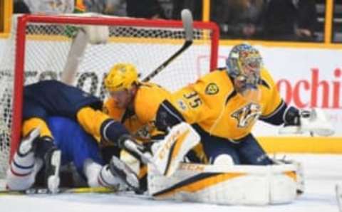 NHL Power Rankings: Nashville Predators goalie Pekka Rinne (35) watches the action after a save by Nashville Predators defenseman Matt Irwin (52) as Nashville Predators left wing Filip Forsberg (9) hits Montreal Canadiens left wing Paul Byron (41) in the crease during the second period at Bridgestone Arena. Mandatory Credit: Christopher Hanewinckel-USA TODAY Sports