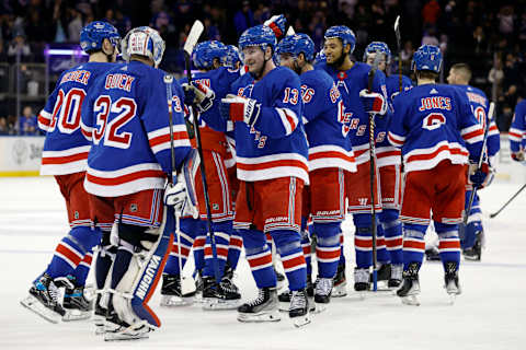 NEW YORK, NEW YORK – NOVEMBER 12: Alexis Lafreniere #13 reacts with Jonathan Quick #32 of the New York Rangers after a shootout against the Columbus Blue Jackets at Madison Square Garden on November 12, 2023 in New York City. The New York Rangers won 4-3 in a shootout. (Photo by Sarah Stier/Getty Images)