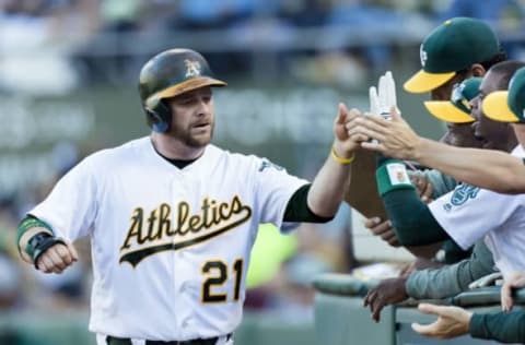 Jun 16, 2017; Oakland, CA, USA; Oakland Athletics catcher Stephen Vogt (21) celebrates scoring against the New York Yankees in the second inning at Oakland Coliseum. Mandatory Credit: John Hefti-USA TODAY Sports