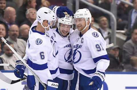 Oct 25, 2016; Toronto, Ontario, CAN; Tampa Bay Lightning forward Nikita Kucherov (86) is greeted by forward Steve Stamkos (91) and defenseman Anton Stralman (6) after scoring against the Toronto Maple Leafs in a 7-3 win at Air Canada Centre. Mandatory Credit: Dan Hamilton-USA TODAY Sports