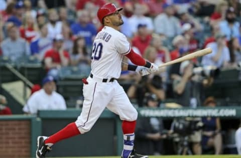 Apr 21, 2016; Arlington, TX, USA; Texas Rangers left fielder Ian Desmond (20) hits a three-run home run during the first inning against the Houston Astros at Globe Life Park in Arlington. Mandatory Credit: Kevin Jairaj-USA TODAY Sports