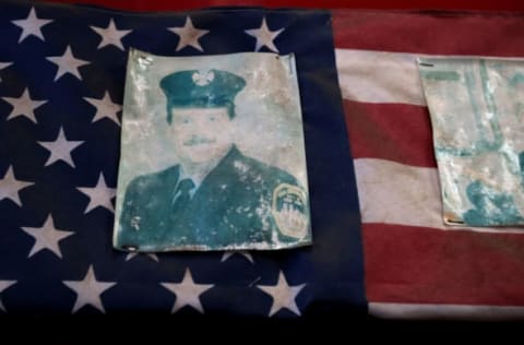 NEW YORK, NEW YORK – SEPTEMBER 10: A faded photograph of the four firefighters from FDNY Engine 6 house who died in the September 11, 2001 terrorist attack hang in the station house on September 10, 2021 in New York City. Engine 6 was a first responder to the World Trade Center and Fire Fighters Paul Beyer, Thomas Holohan and William R. Johnston and Lt. Thomas O’Hagan were killed in the North Tower. (Photo by Chip Somodevilla/Getty Images)