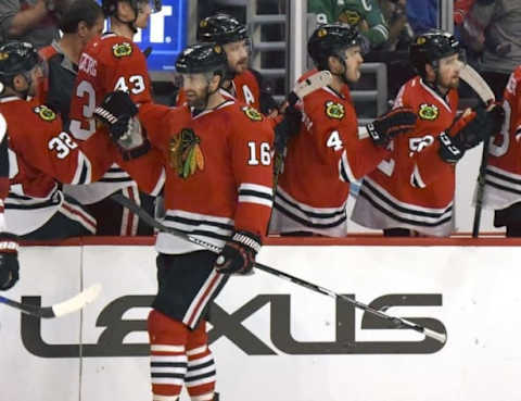 Apr 5, 2016; Chicago, IL, USA; Chicago Blackhawks left wing Andrew Ladd (16) celebrates with teammates after scoring a goal in the second period against the Arizona Coyotes at the United Center. Mandatory Credit: Matt Marton-USA TODAY Sports