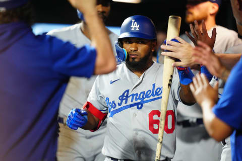 Jun 28, 2023; Denver, Colorado, USA; Los Angeles Dodgers third baseman Yonny Hernandez (60) celebrates his sacrifice fly scoring run in the eighth inning against the Colorado Rockies at Coors Field. Mandatory Credit: Ron Chenoy-USA TODAY Sports