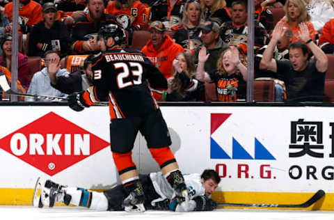 ANAHEIM, CA: Kevin Labanc #62 of the San Jose Sharks loses his helmet after a hit by Francois Beauchemin #23 of the Anaheim Ducks in Game Two of the 2018 Western Conference First Round on April 14, 2018. (Photo by Debora Robinson/NHLI via Getty Images)