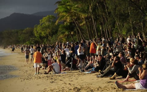 Spectators gather in Palm Cove, Australia