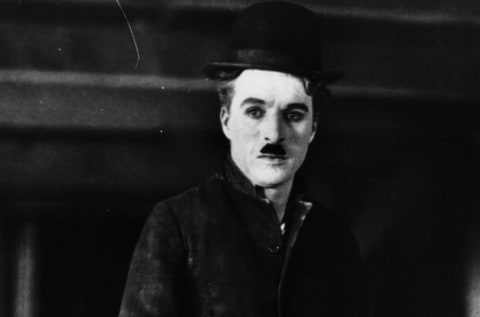 Charlie Chaplin in his trademark top hat.