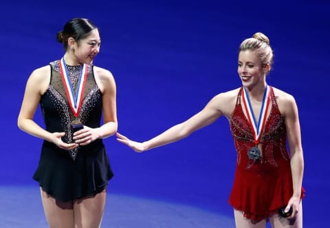 Mirai Nagasu (left) and Ashley Wagner stand at the podium during the medal ceremony following the free skate program during the 2014 Prudential U.S. Figure Skating Championships.