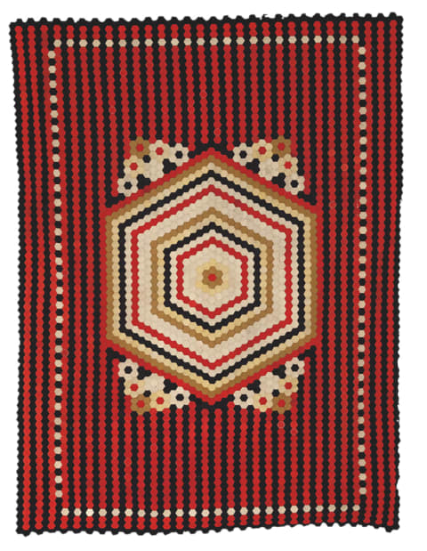 Soldier’s Hexagon Quilt, Artist unidentified, Crimea or United Kingdom, Late 19th century, Wool from military uniforms, 85 inches by 64 inches