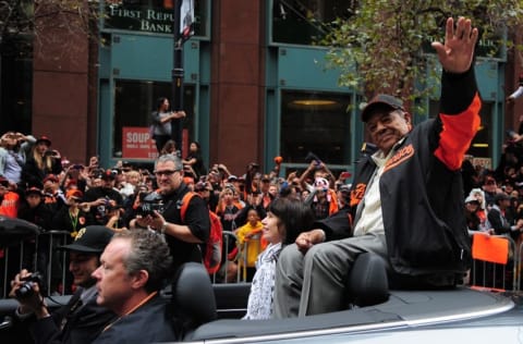 October 31, 2012; San Francisco, CA, USA; San Francisco Giants former center fielder Willie Mays waves to the crowd while riding in a car during the World Series victory parade at Market Street. The Giants defeated the Detroit Tigers in a four-game sweep to win the 2012 World Series. Mandatory Credit: Kyle Terada-USA TODAY Sports