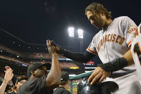 May 30, 2014; St. Louis, MO, USA; San Francisco Giants left fielder Michael Morse (38) is congratulated by teammates after scoring a run against the St. Louis Cardinals at Busch Stadium. Mandatory Credit: Jasen Vinlove-USA TODAY Sports