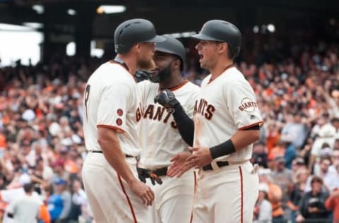 Apr 7, 2016; San Francisco, CA, USA; San Francisco Giants right fielder Hunter Pence (8) celebrates with center fielder Denard Span (2) and second baseman Joe Panik (12) after hitting a grand slam against the San Francisco Giants during the eighth inning at AT&T Park. The Giants won 12-6. Mandatory Credit: Ed Szczepanski-USA TODAY Sports