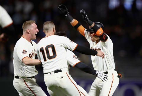 SAN FRANCISCO, CA – AUGUST 28: Gorkys Hernandez #7 of the San Francisco Giants is congratulated by teammates after he hit a single that scored the game-winning run in the ninth inning against the Arizona Diamondbacks at AT&T Park on August 28, 2018 in San Francisco, California. (Photo by Ezra Shaw/Getty Images)