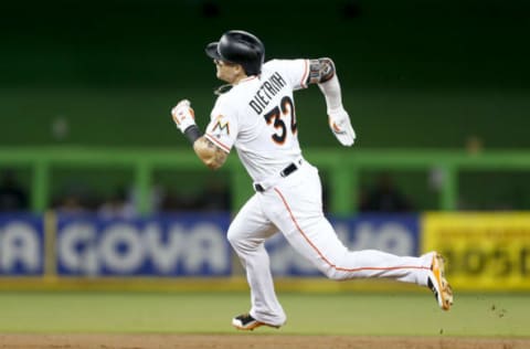 MIAMI, FL – SEPTEMBER 03: Derek Dietrich #32 of the Miami Marlins rounds second base after hitting a triple in the second inning against the Philadelphia Phillies at Marlins Park on September 3, 2018 in Miami, Florida. (Photo by Michael Reaves/Getty Images)