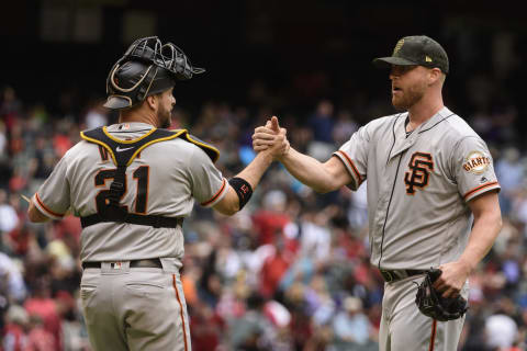 PHOENIX, ARIZONA – MAY 19: Stephen Vogt #21 and Will Smith #13 of the San Francisco Giants celebrate after closing out the tenth inning of the MLB game against the Arizona Diamondbacks at Chase Field on May 19, 2019 in Phoenix, Arizona. The San Francisco Giants won 3-2. (Photo by Jennifer Stewart/Getty Images)