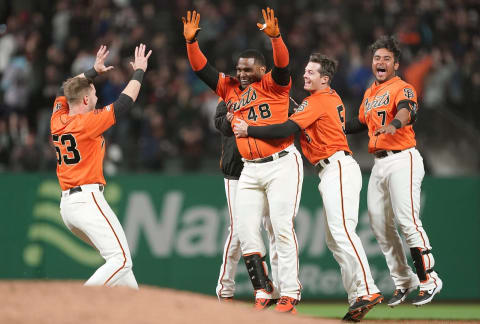 SAN FRANCISCO, CA – JULY 19: Pablo Sandoval #48 of the San Francisco Giants and teammates celebrates after Sandoval hit a fly ball to left field that was dropped for an error by Dominic Smith #22 of the New York Mets allowing the Giants to win the game 1-0 in 10 inning at Oracle Park on July 19, 2019 in San Francisco, California. (Photo by Thearon W. Henderson/Getty Images)