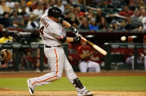 PHOENIX, AZ – APRIL 08: Casey McGehee #14 of the San Francisco Giants hits a two-run home run against the Arizona Diamondbacks during the ninth inning of the MLB game at Chase Field on April 8, 2015 in Phoenix, Arizona. (Photo by Christian Petersen/Getty Images)