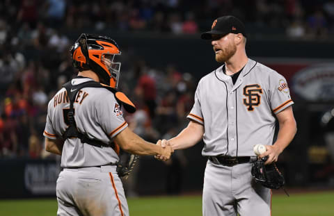 PHOENIX, AZ – AUGUST 05: Will Smith #13 and Nick Hundley #5 of the San Francisco Giants celebrate a 3-2 win against the Arizona Diamondbacks at Chase Field on August 5, 2018 in Phoenix, Arizona. (Photo by Norm Hall/Getty Images)