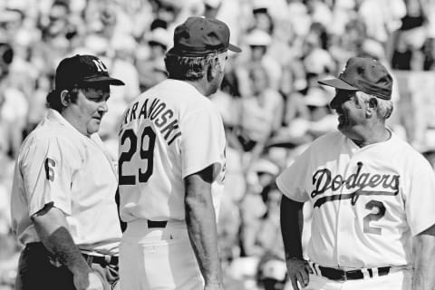 Ron Perranoski #29 and Tommy Lasorda #2 chat with umpire Bruce Froemming during a 1981 spring training game. (Photo by Jayne Kamin-Once/Getty Images)