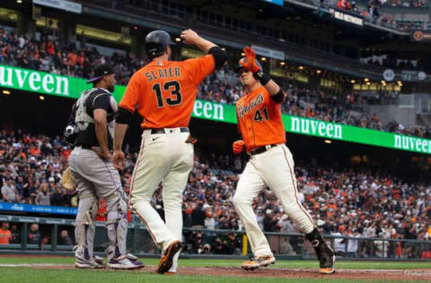 SAN FRANCISCO, CALIFORNIA – AUGUST 13: Wilmer Flores #41 of the San Francisco Giants is congratulated by Austin Slater #13 after hitting a three run home run against the Colorado Rockies during the first inning at Oracle Park on August 13, 2021 in San Francisco, California. (Photo by Jason O. Watson/Getty Images)