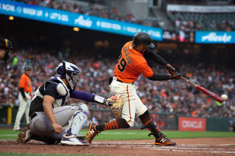 SAN FRANCISCO, CALIFORNIA – AUGUST 13: Thairo Estrada #39 of the SF Giants hits an RBI single against the Colorado Rockies during the first inning at Oracle Park on August 13, 2021. (Photo by Jason O. Watson/Getty Images)