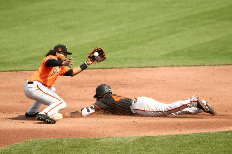 Former SF Giants infielder Abiatel Avelino slides under the tag of SF Giants prospect Luis Toribio during an intrasquad game at Oracle Park on July 15, 2020 in San Francisco, California. (Photo by Ezra Shaw/Getty Images)